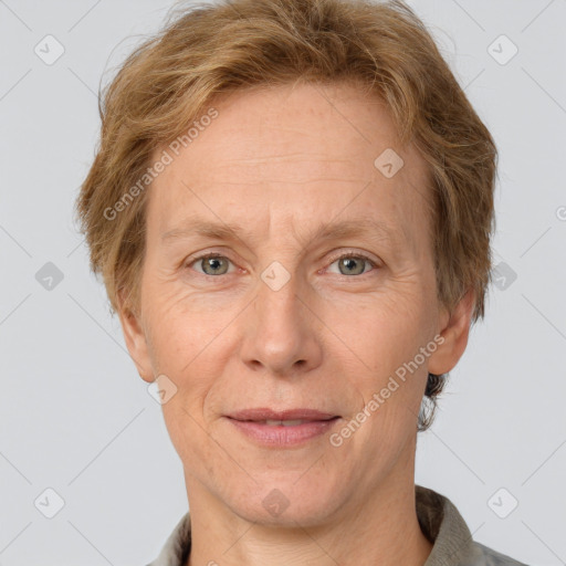 Joyful white adult female with short  brown hair and grey eyes