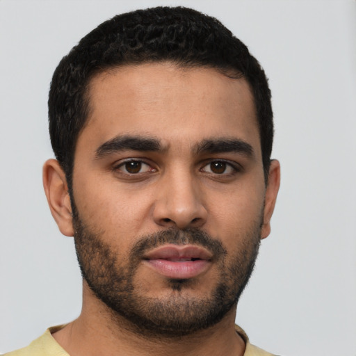 Neutral latino young-adult male with short  black hair and brown eyes