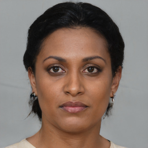 Neutral black young-adult female with short  brown hair and brown eyes