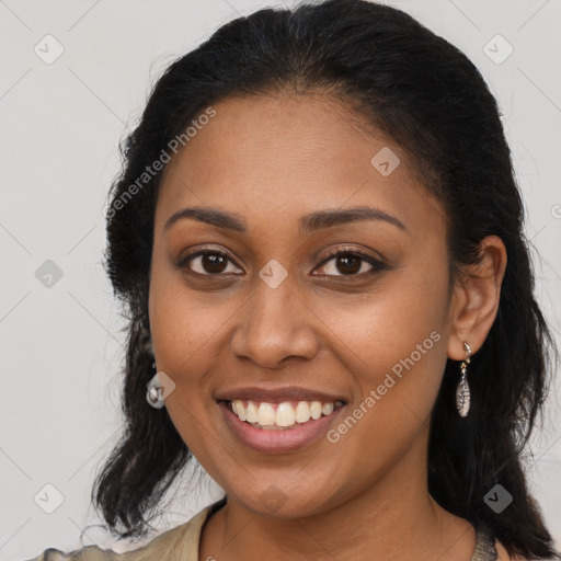 Joyful latino young-adult female with long  brown hair and brown eyes