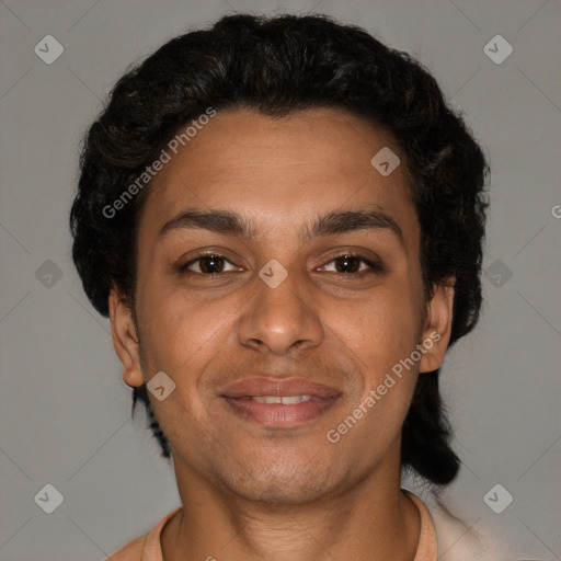 Joyful black young-adult male with short  brown hair and brown eyes