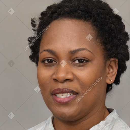 Joyful black adult female with short  brown hair and brown eyes