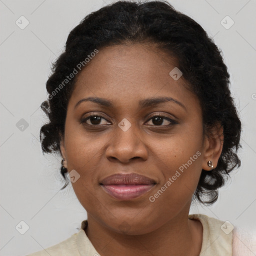 Joyful black adult female with short  brown hair and brown eyes