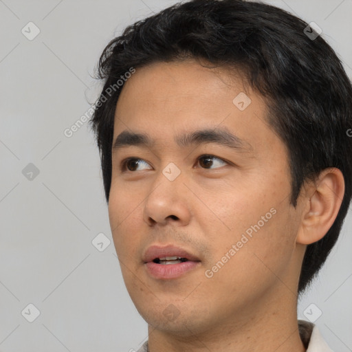 Neutral white young-adult male with short  black hair and brown eyes