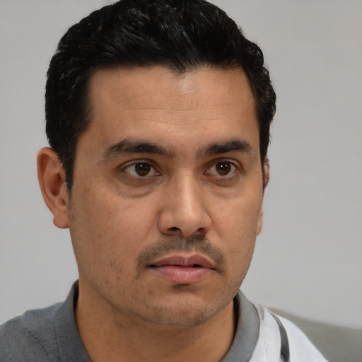 Neutral white young-adult male with short  black hair and brown eyes