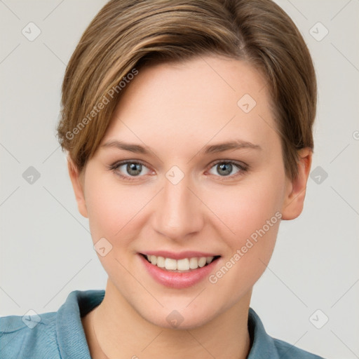 Joyful white young-adult female with short  brown hair and grey eyes