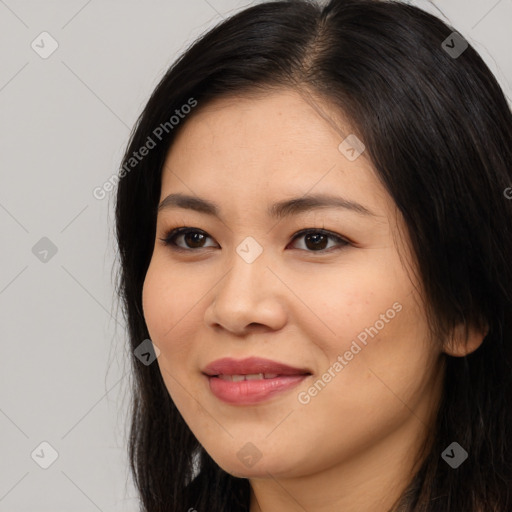 Joyful asian young-adult female with long  brown hair and brown eyes