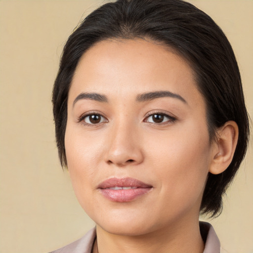 Joyful white young-adult female with medium  brown hair and brown eyes