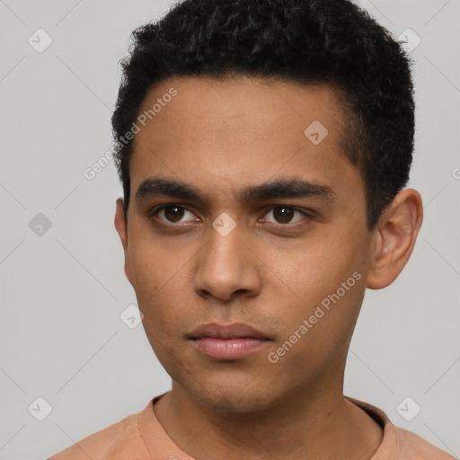 Neutral latino young-adult male with short  black hair and brown eyes