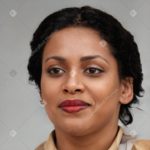 Joyful black young-adult female with medium  brown hair and brown eyes