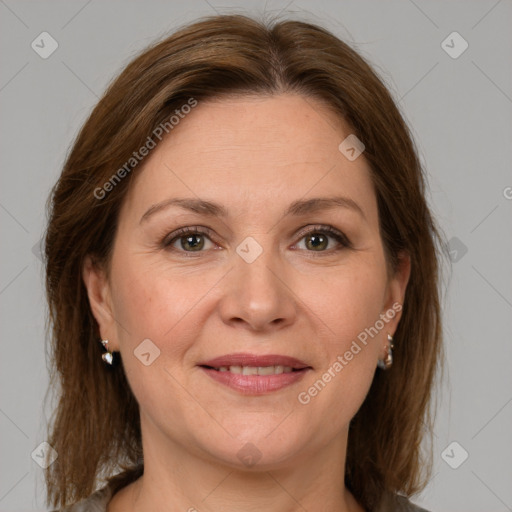 Joyful white adult female with medium  brown hair and grey eyes