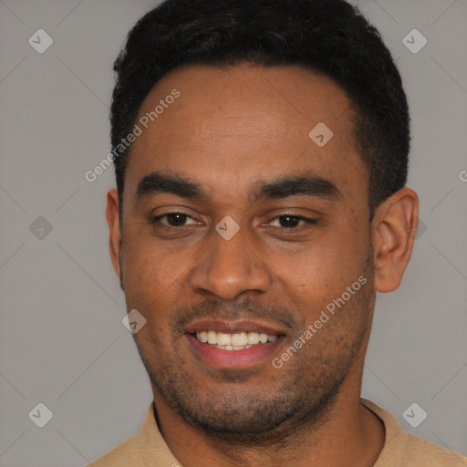 Joyful black young-adult male with short  black hair and brown eyes