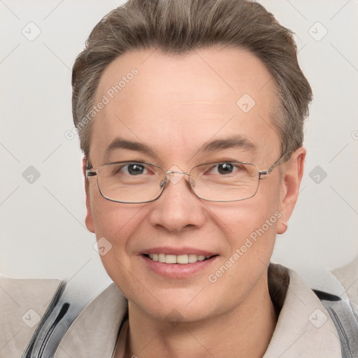 Joyful white adult male with short  brown hair and grey eyes