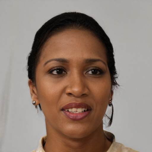 Joyful black young-adult female with medium  brown hair and brown eyes