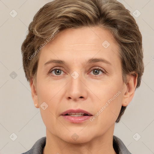 Joyful white adult female with short  brown hair and brown eyes