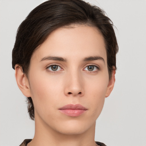 Neutral white young-adult female with short  brown hair and brown eyes