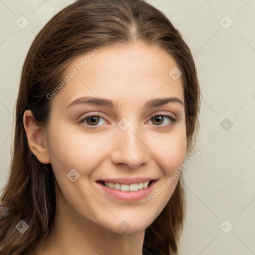 Joyful white young-adult female with long  brown hair and green eyes