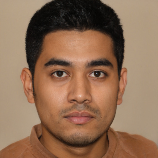 Neutral latino young-adult male with short  black hair and brown eyes