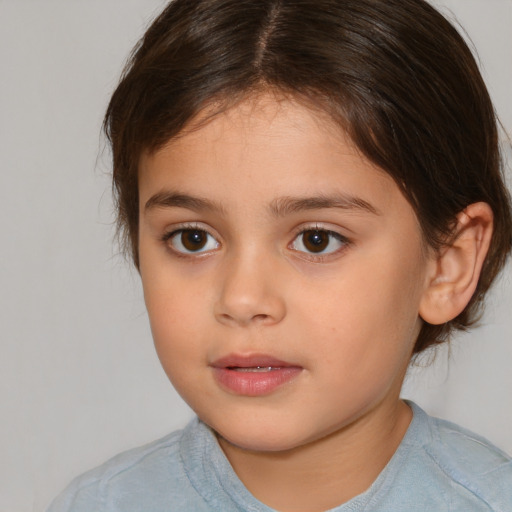 Joyful white child female with medium  brown hair and brown eyes