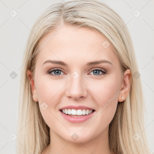 Joyful white young-adult female with long  brown hair and blue eyes