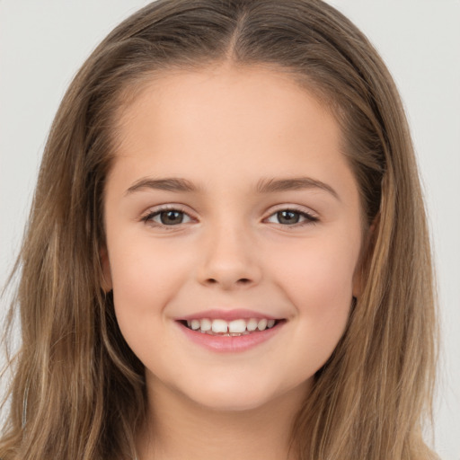 Joyful white child female with long  brown hair and brown eyes