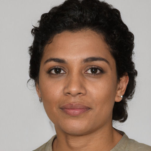 Neutral black young-adult female with short  black hair and brown eyes