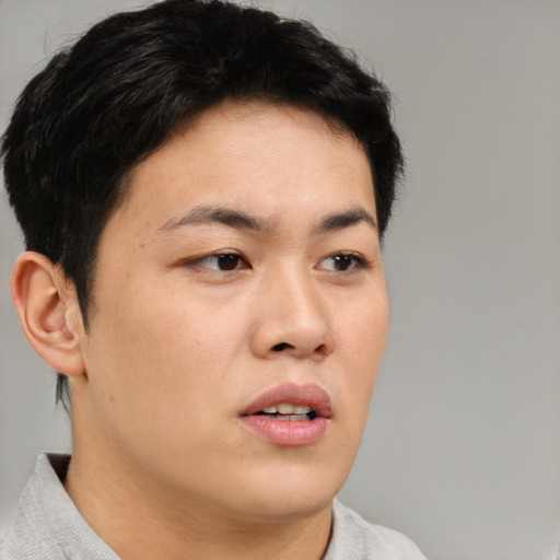 Neutral asian young-adult male with short  brown hair and brown eyes