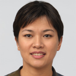 Joyful asian young-adult female with short  brown hair and brown eyes