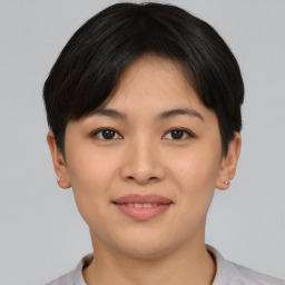 Joyful asian young-adult female with short  brown hair and brown eyes