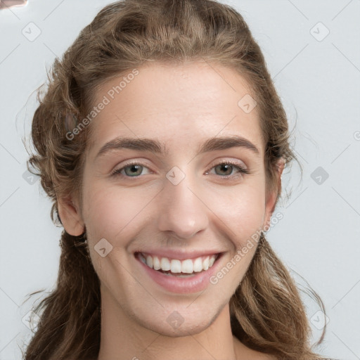 Joyful white young-adult female with long  brown hair and green eyes