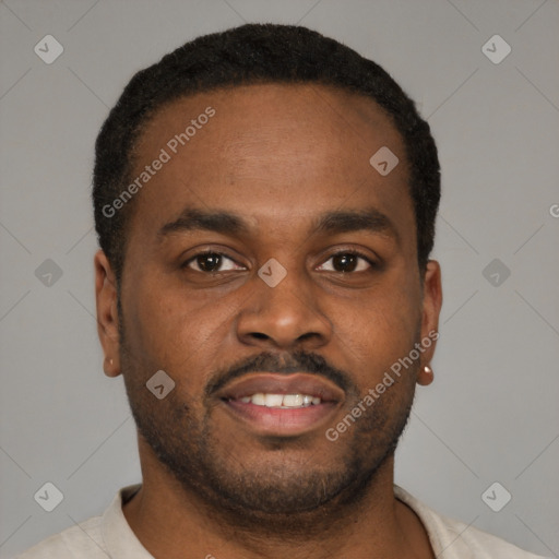 Joyful latino young-adult male with short  brown hair and brown eyes