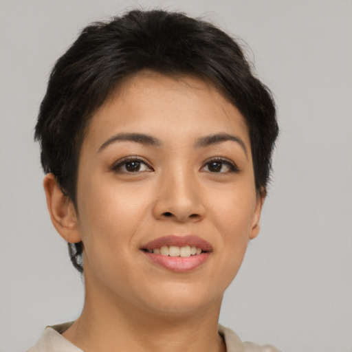 Joyful asian young-adult female with short  brown hair and brown eyes