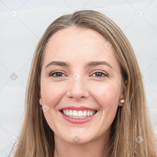 Joyful white young-adult female with long  brown hair and grey eyes