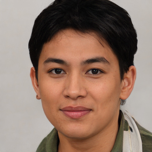 Joyful asian young-adult female with short  brown hair and brown eyes