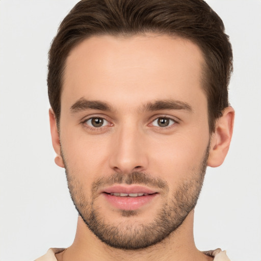 Joyful white young-adult male with short  brown hair and brown eyes