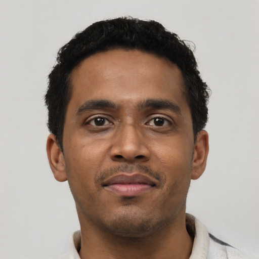 Neutral black young-adult male with short  black hair and brown eyes
