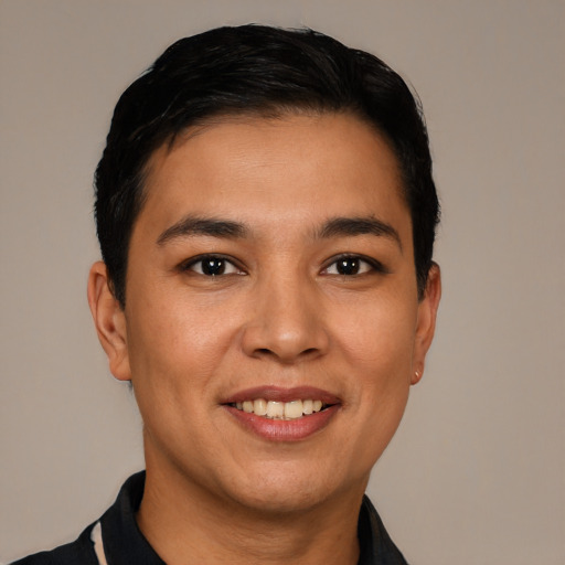Joyful white young-adult male with short  black hair and brown eyes