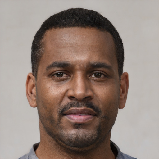 Neutral latino adult male with short  black hair and brown eyes