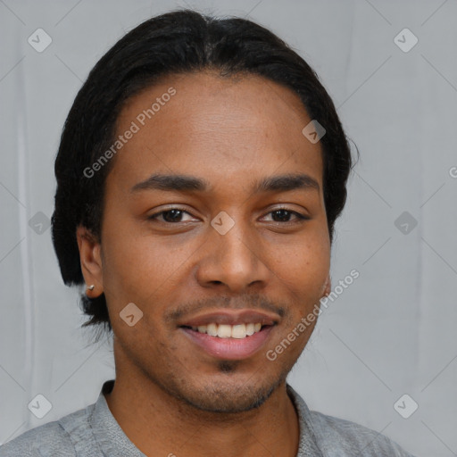 Joyful latino young-adult male with short  brown hair and brown eyes