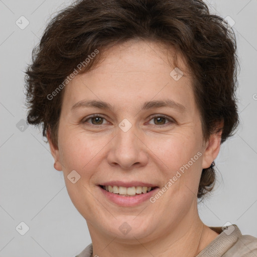 Joyful white adult female with short  brown hair and grey eyes