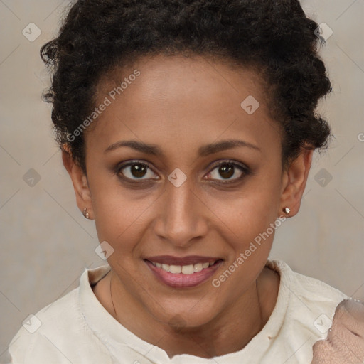 Joyful black young-adult female with short  brown hair and brown eyes