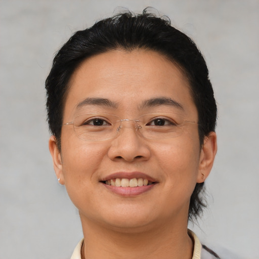 Joyful asian young-adult female with short  brown hair and brown eyes