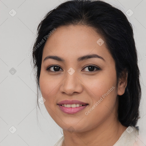 Joyful latino young-adult female with medium  brown hair and brown eyes