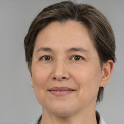 Joyful white adult female with medium  brown hair and brown eyes