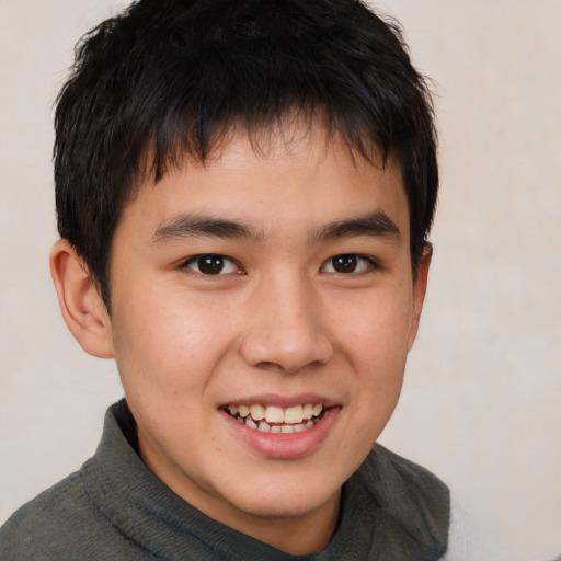 Joyful white child male with short  brown hair and brown eyes