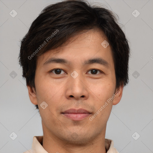 Joyful asian young-adult male with short  brown hair and brown eyes