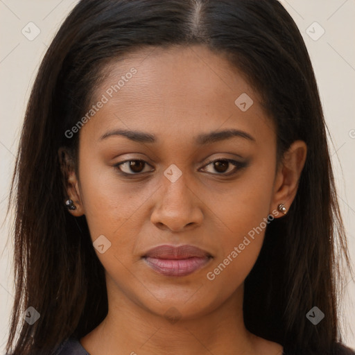 Joyful black young-adult female with long  brown hair and brown eyes