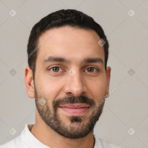 Joyful white young-adult male with short  black hair and brown eyes