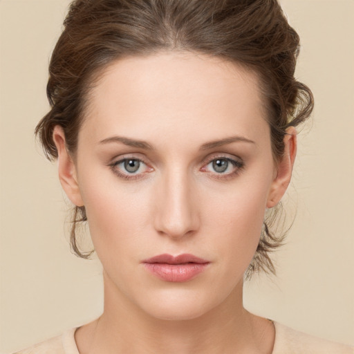 Neutral white young-adult female with medium  brown hair and green eyes