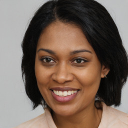 Joyful black young-adult female with medium  brown hair and brown eyes